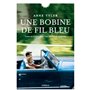 UNE BOBINE DE FIL BLEU