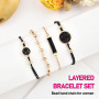 Edary Lot de 4 bracelets bohèmes superposés en cristal noir avec perles dorées et chaîne de main empilables faits à la main pour
