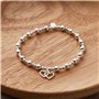 Philip Jones Bracelet élastique en perles avec maillons en forme de