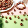 TOAOB 200pcs Perles en Bois Multicolores Imprimées Peintes en Bois Afrique Macrame Spacer Perles 11 mm x 12 mm pour Décoration d